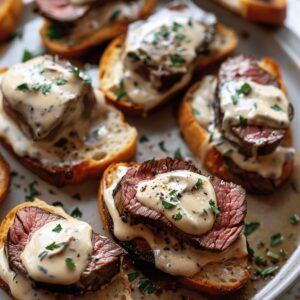 Elegant Beef Tenderloin Crostini With Parmesan Cream Sauce Recipe